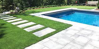 stone paver walkway with artificial grass